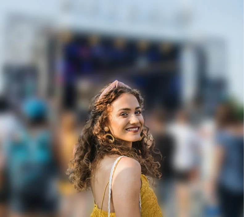 Woman at a music festival with the background blurred to make her stand out